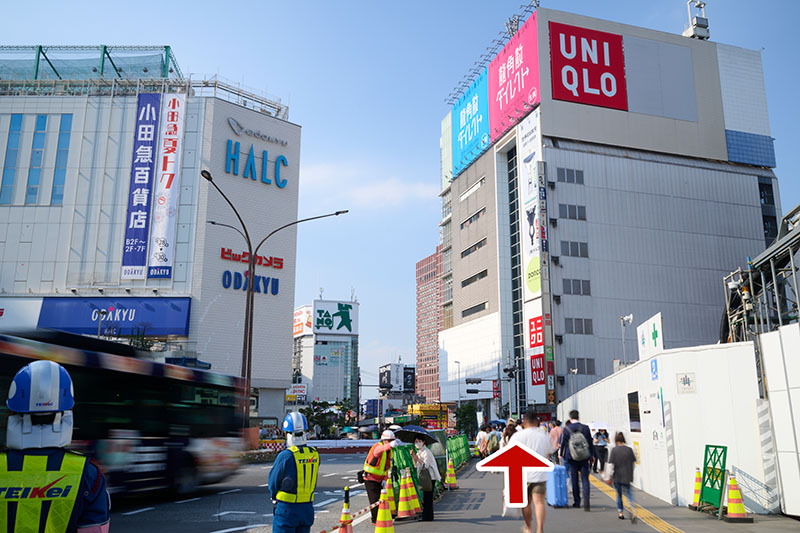 From the ticket gate at the west exit of JR, go to the ground level and head towards the Odakyu HALC Building and Uniqlo Building.